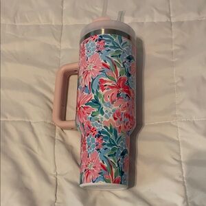 Colorful steel mug with straw